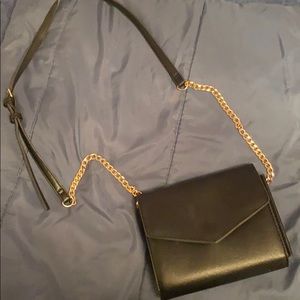 Black purse with gold chain